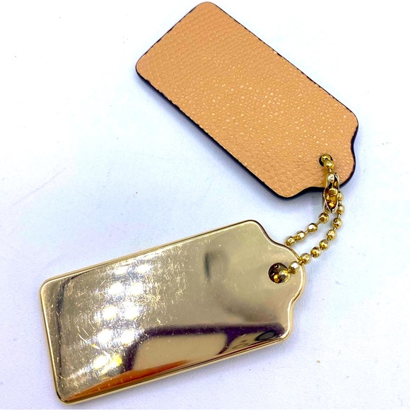 Coach Two Keychains A Gold One And Tan One Coach New York Is On The Front - Picture 4 of 5